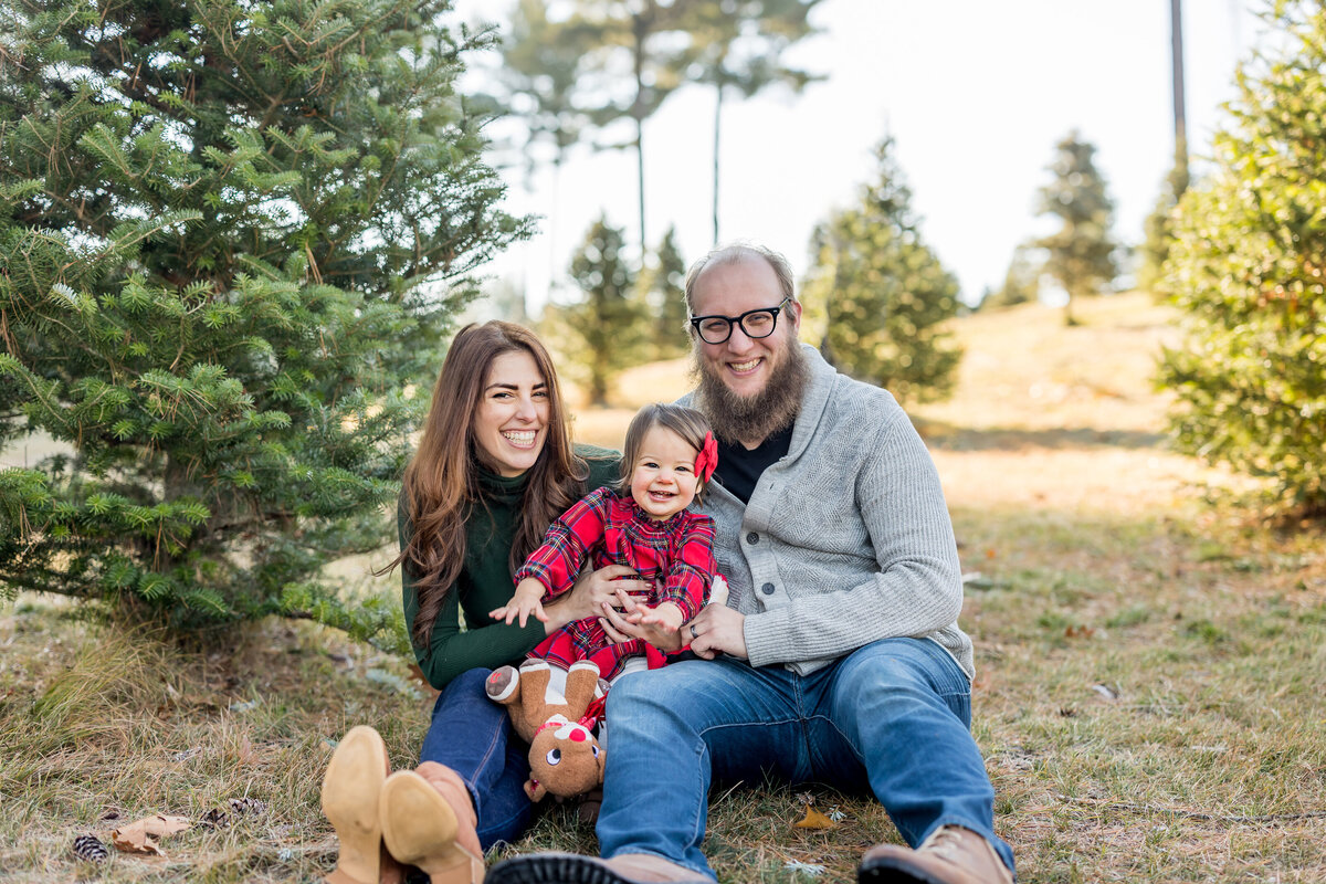 family at tree farm for photo shoot christmas photos