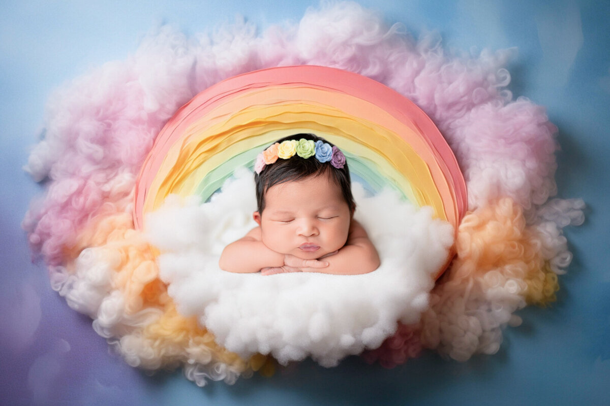 Colorful newborn rainbow setup celebrating a rainbow baby – photographed in Houston