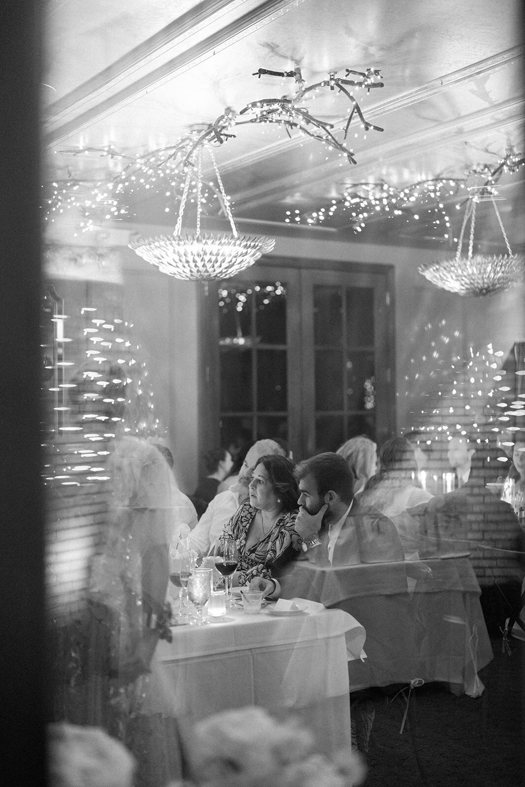 Double exposure effect of bride and groom during Café Cortina reception, artistic Michigan wedding photography.