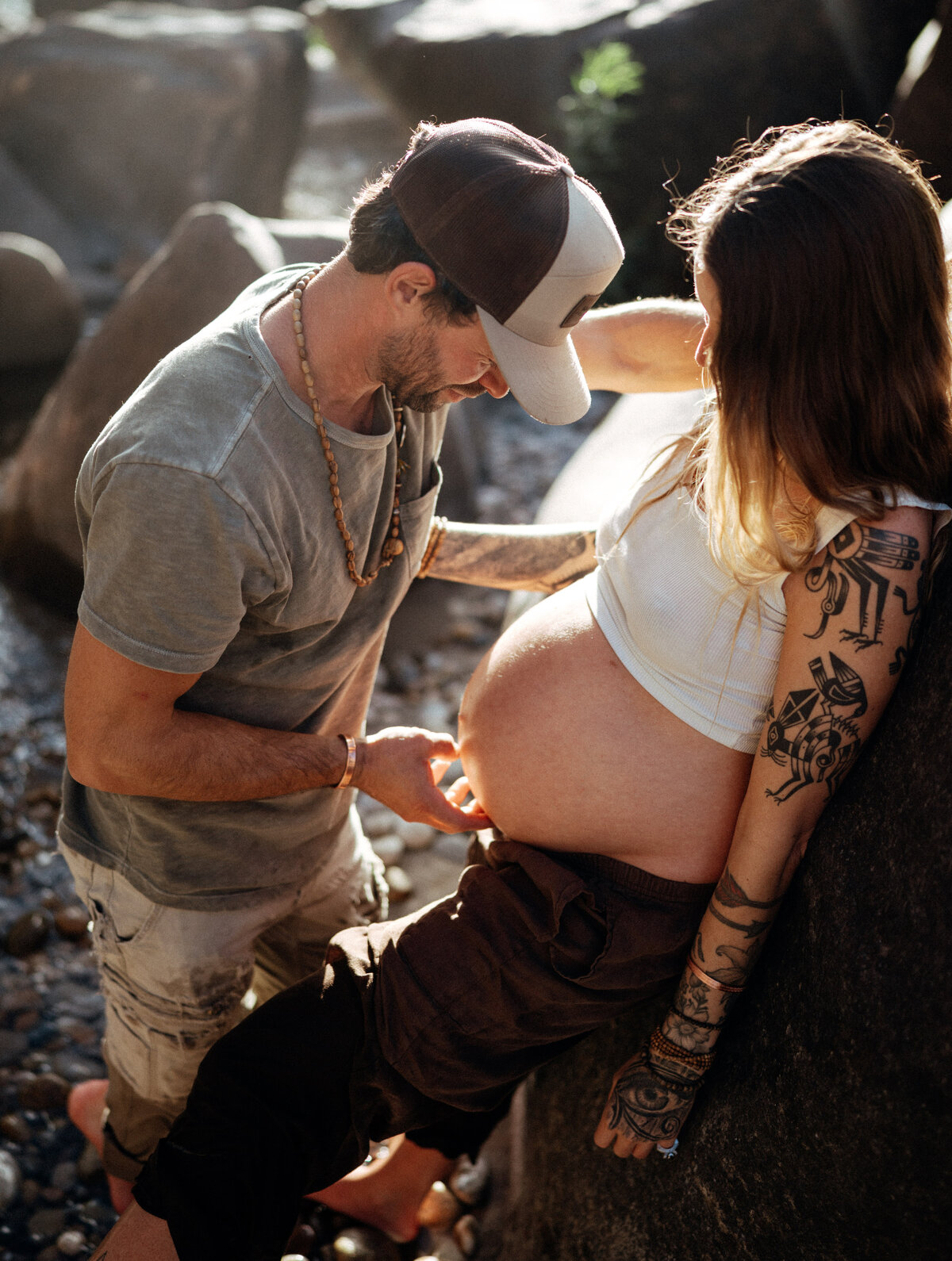 Couple during golden hour engagement and maternity shoot in Riggins, Idaho wedding/elopement - photographed by The Storytellers