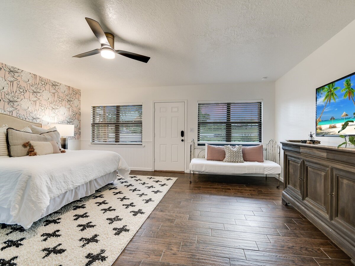 large double bedroom suite with tv and vceiling fan