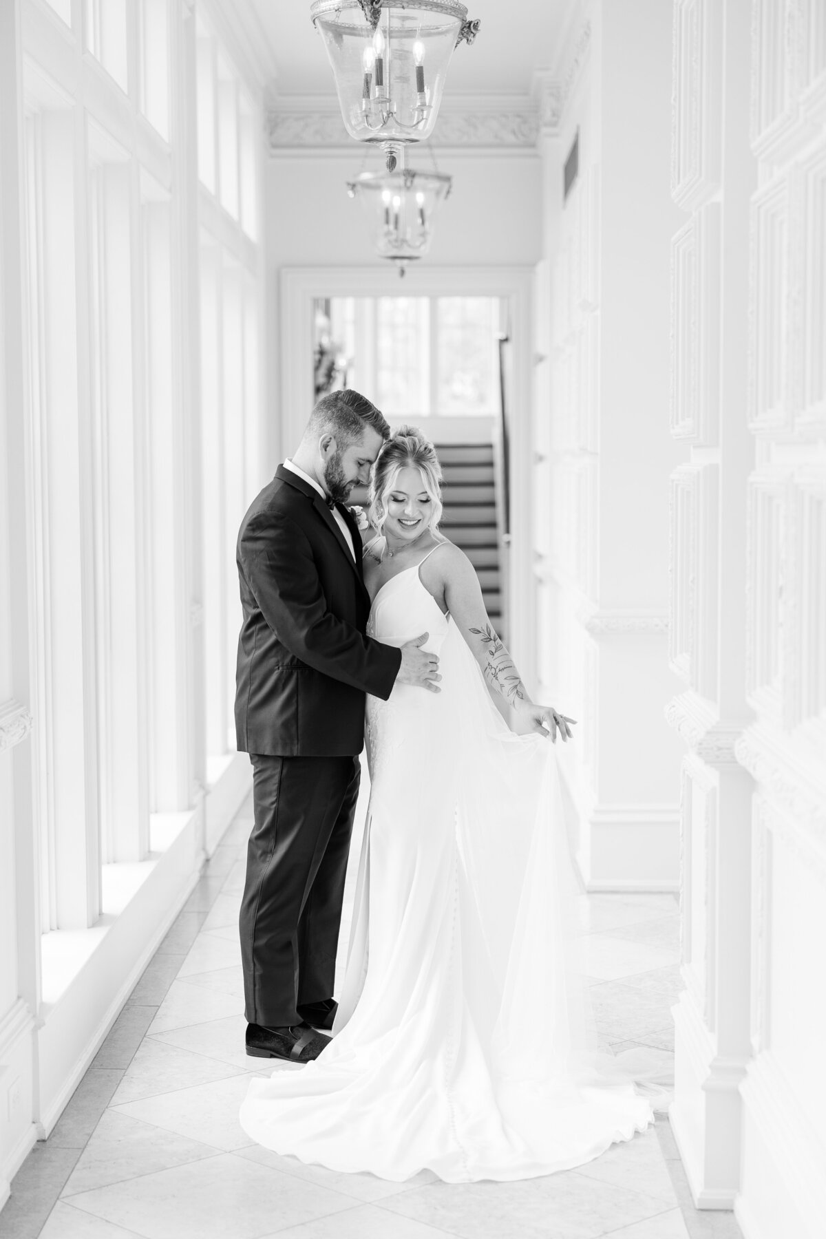 black-and-white-portrait-of-bride-and-groom-in-hallway