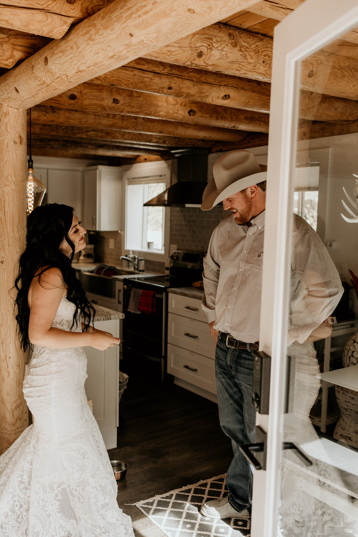 bride and groom having a first look in a cabin