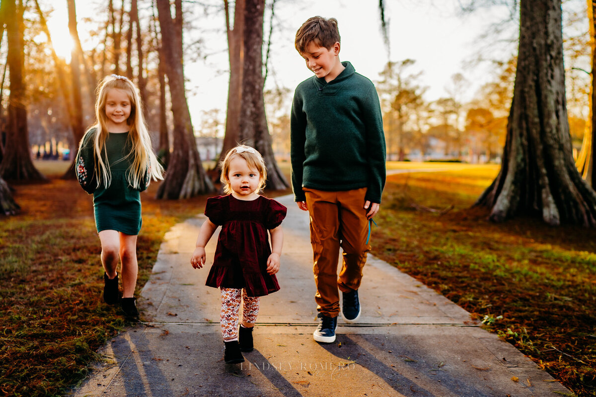 candid pose of children walking at sunset in patterson, la