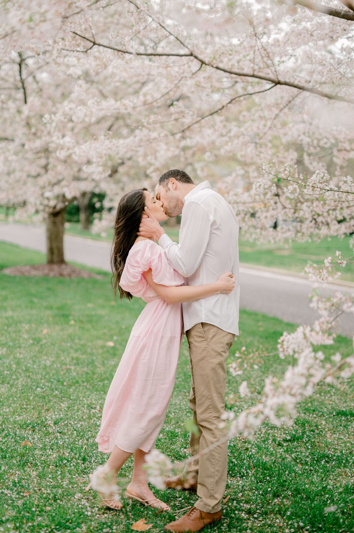 couple kissing during wedding engagement photos  by Rachael Mattio Photography