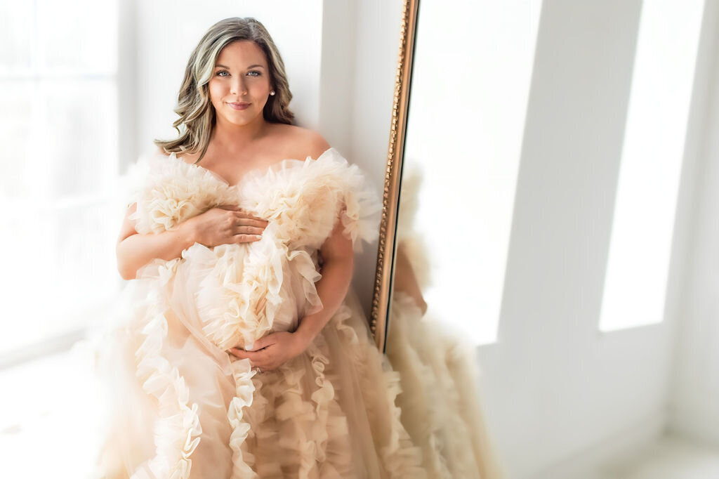 Expecting mother in flowing dress at studio in Cornelius NC