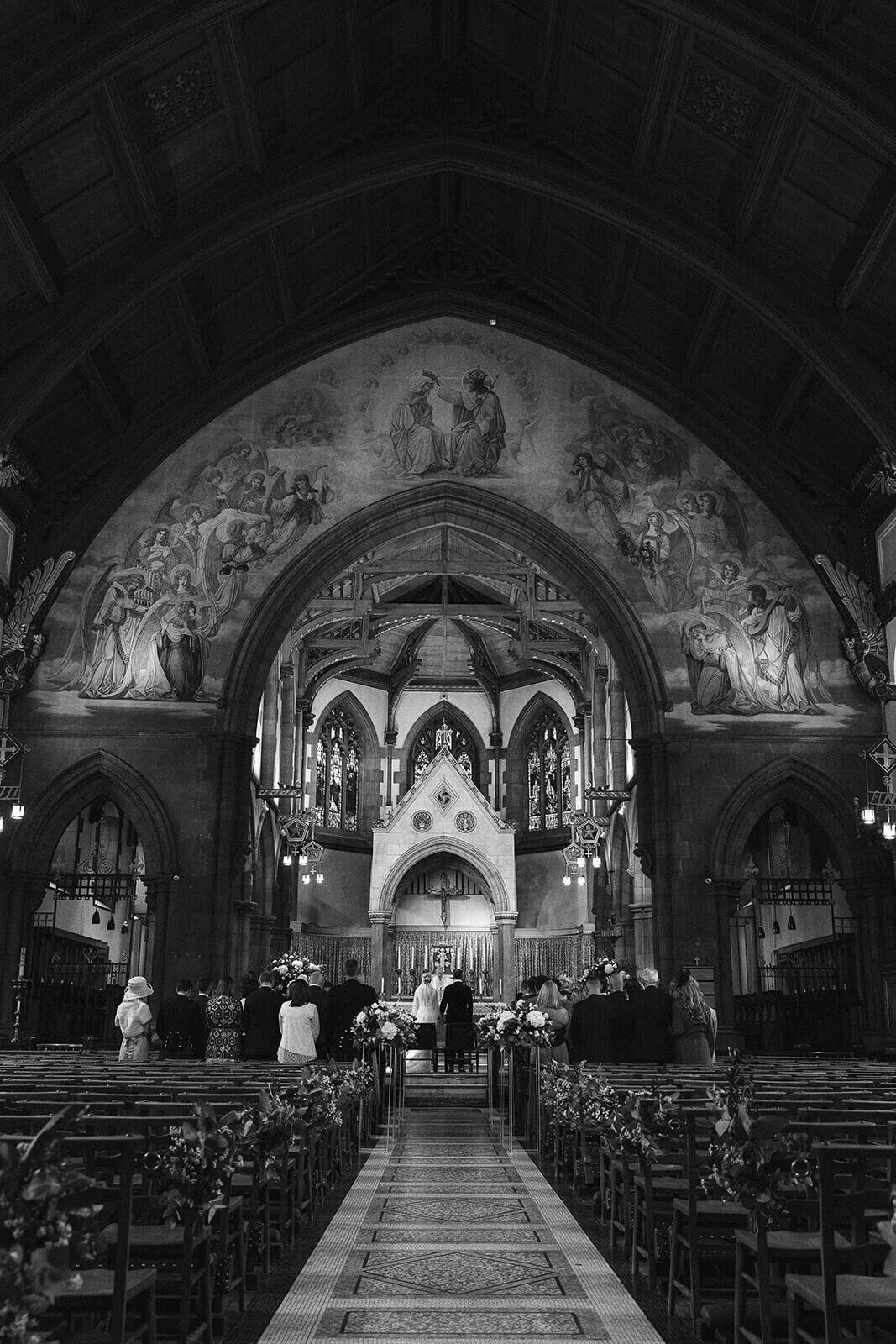 A view of a wedding ceremony from the rear of an Edinburgh Cathedral