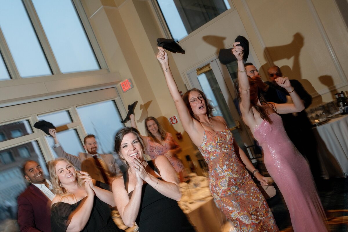 wedding-guests-celebrating-entrance-of-newlyweds-wedding-celebration