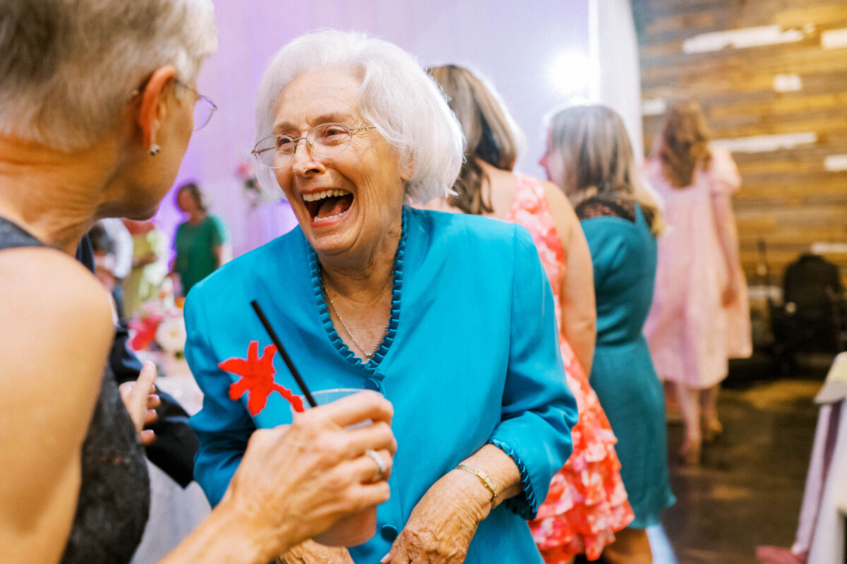 old-lady-in-blue-dress-laughing-at-friend