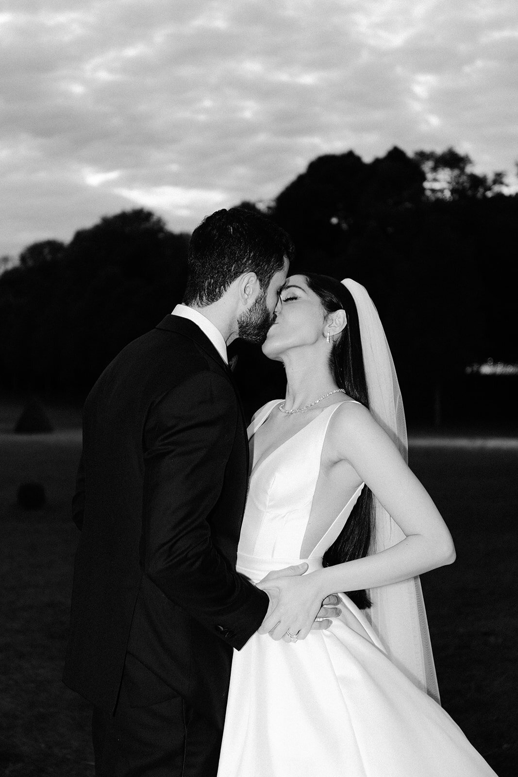 Bride and groom kissing