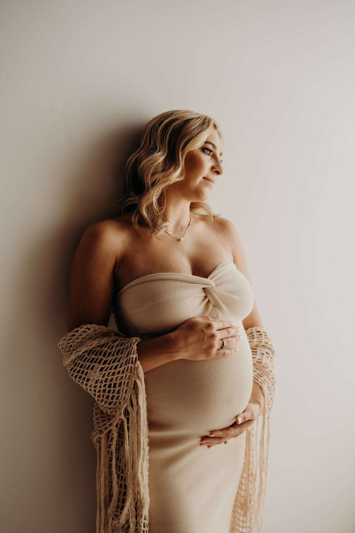 fine art maternity portrait in cream sweetheart dress
