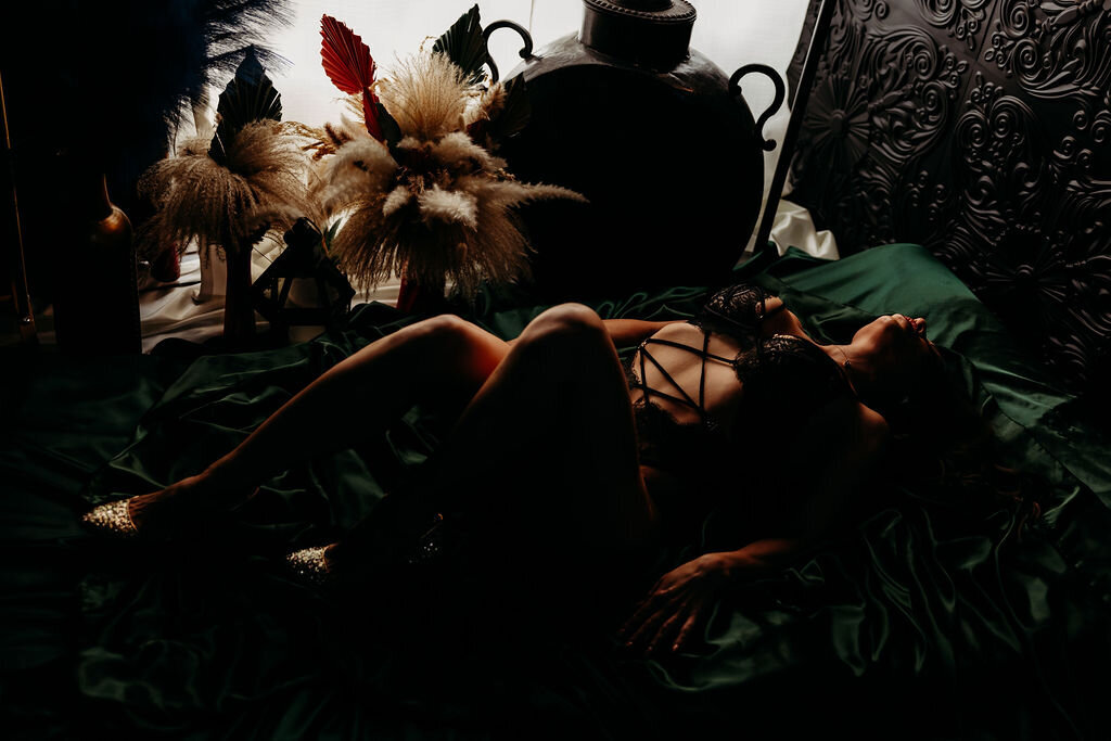 Boudoir photography woman in black lingerie on bed with green sheets Lubbock, Texas Boudoir photographer in Amarillo TX