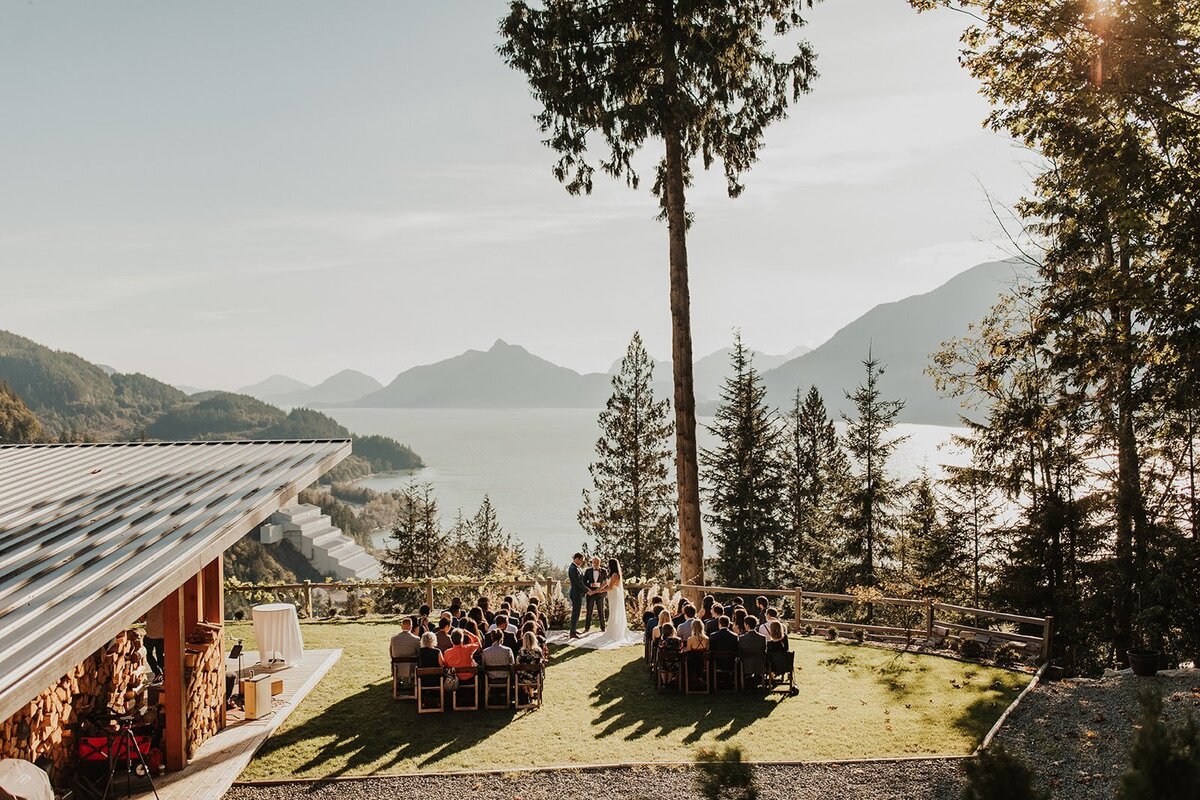 Drone shot of intimate wedding ceremony overlooking Squamish & Howe Sound in British Columbia!