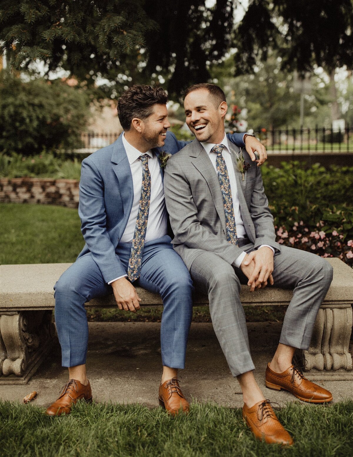 Two grooms portraits at outside wedding venue in Colorado