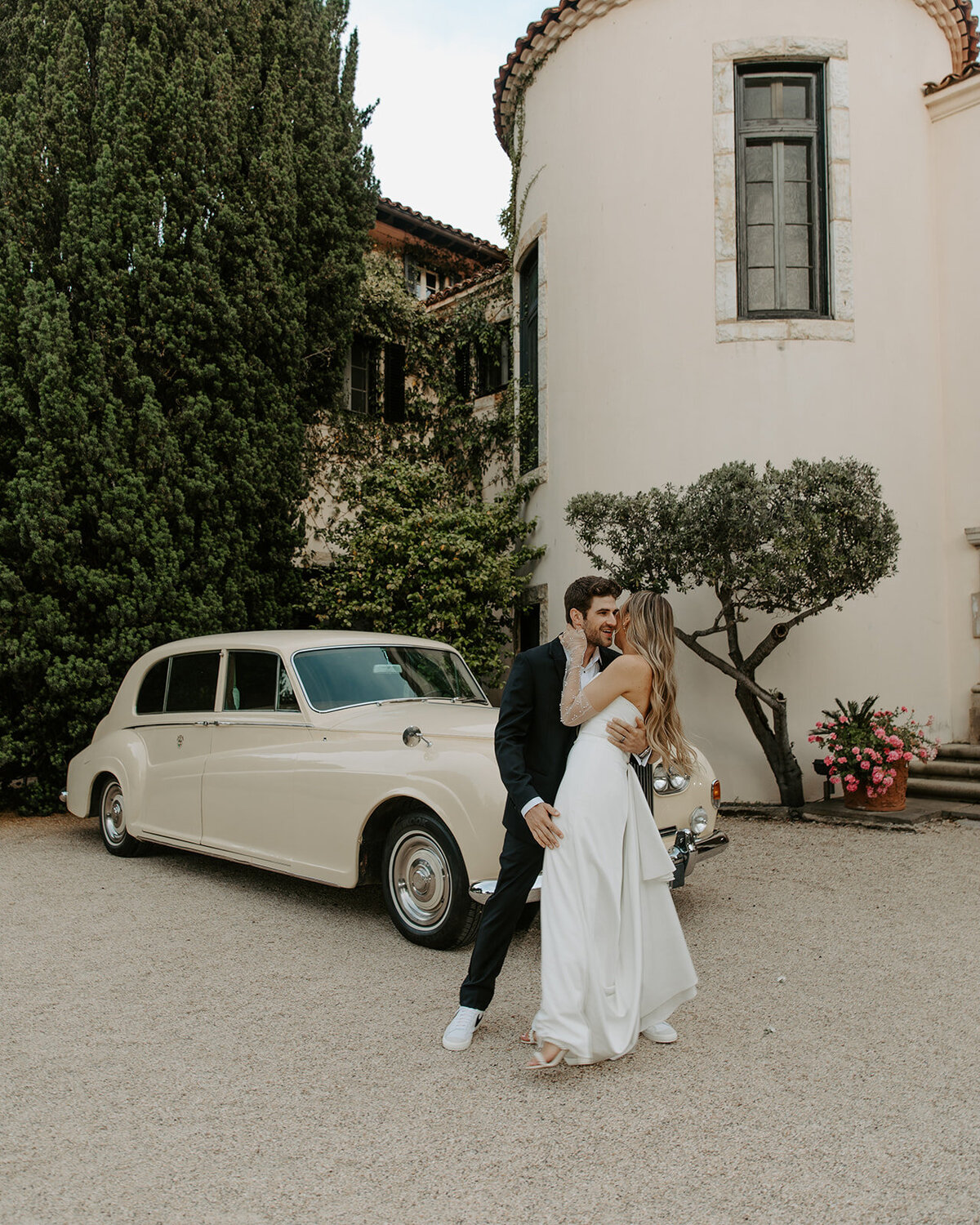 Couple in front of vintage car