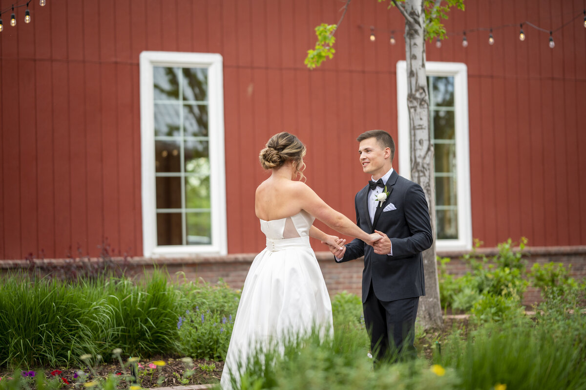 First look with bride and Groom at wedding venue in monument Colorado, Groom smiling