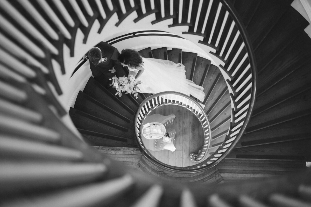 Bride and groom kissing at their wedding reception, taken by Asheville Wedding Photographer Simon Anthony Photography