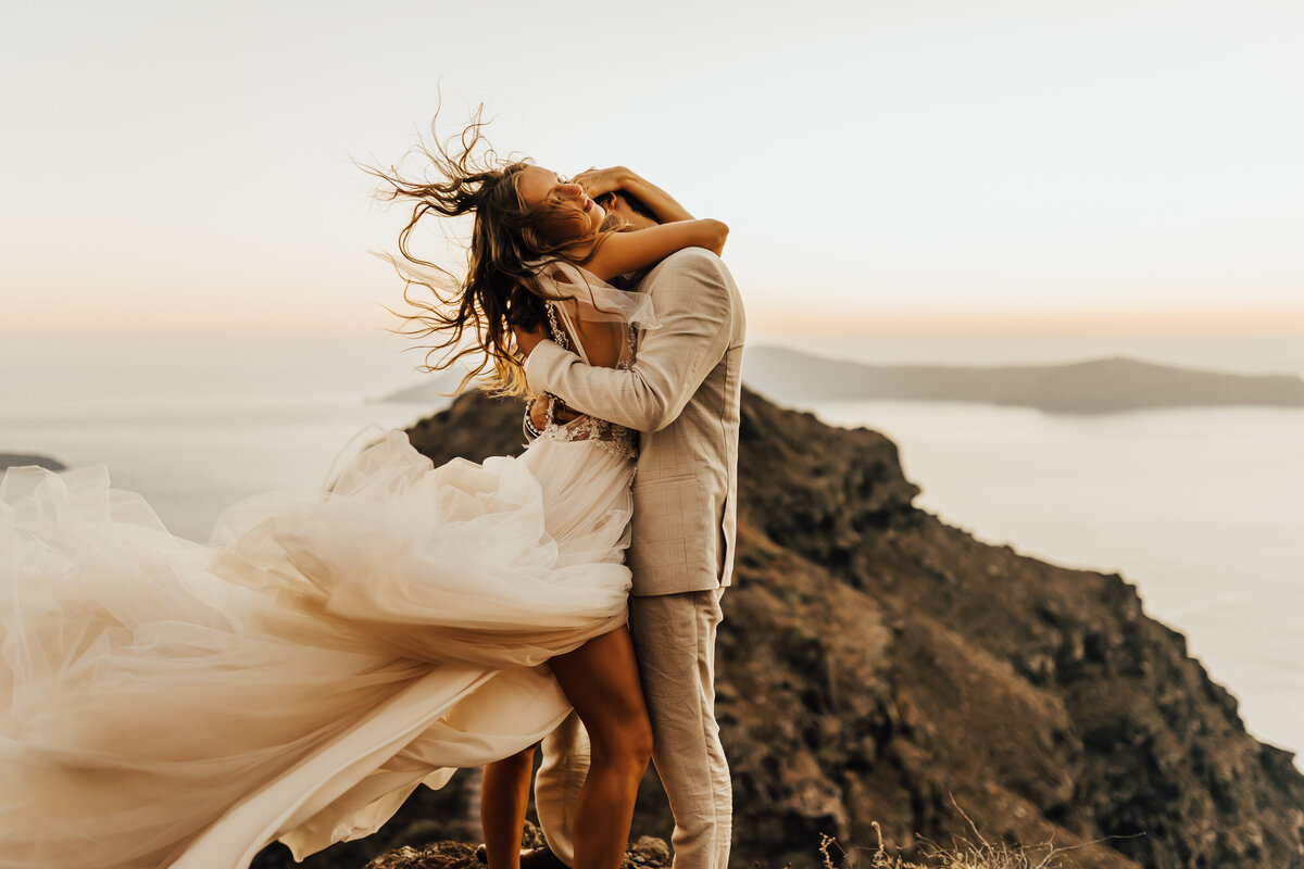 Santorini elopement on cliff
