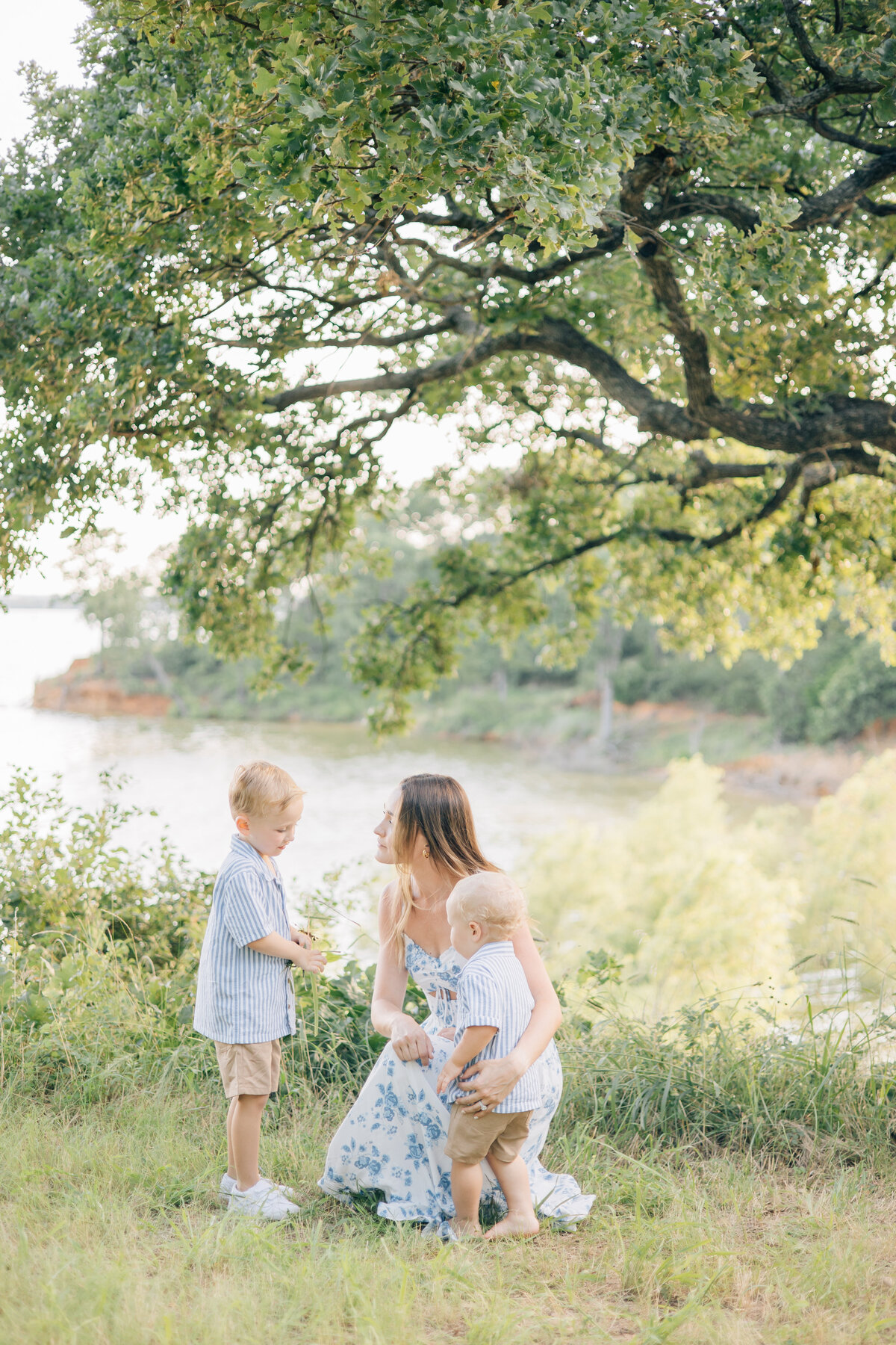 Lake view motherhood picture with her two boys