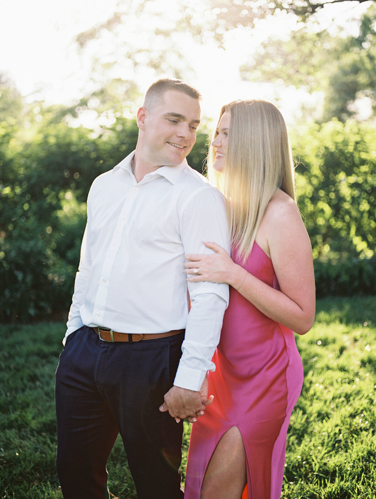 Man looks back at fiancé in Columbus park shot by Philly-based photographer.