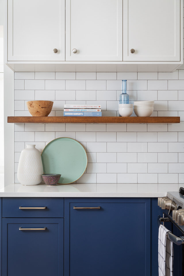 Two-tone kitchen cabinets - subway tiles- floating shelf