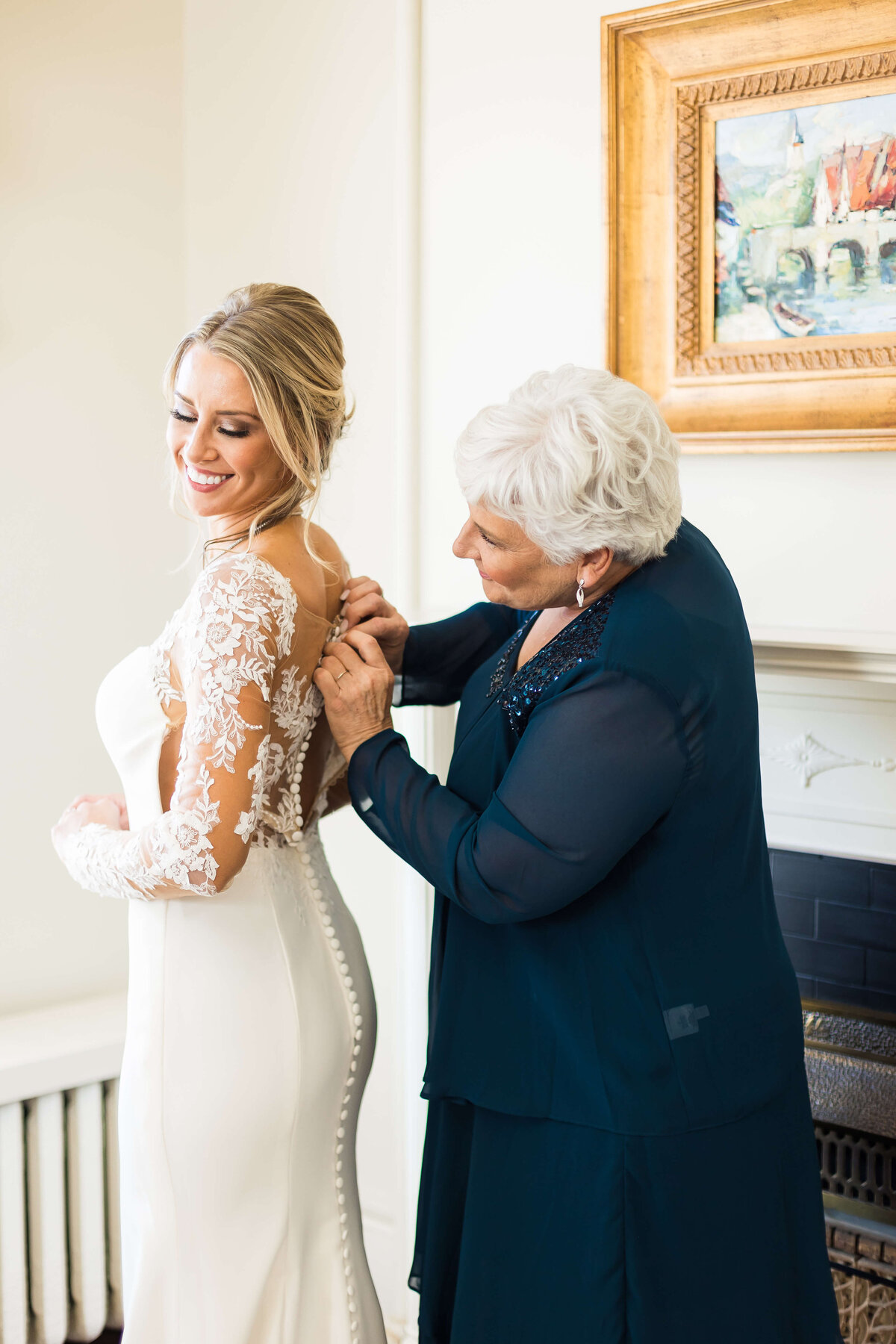 Bride having dress adjusted  at The Carrick House, KY