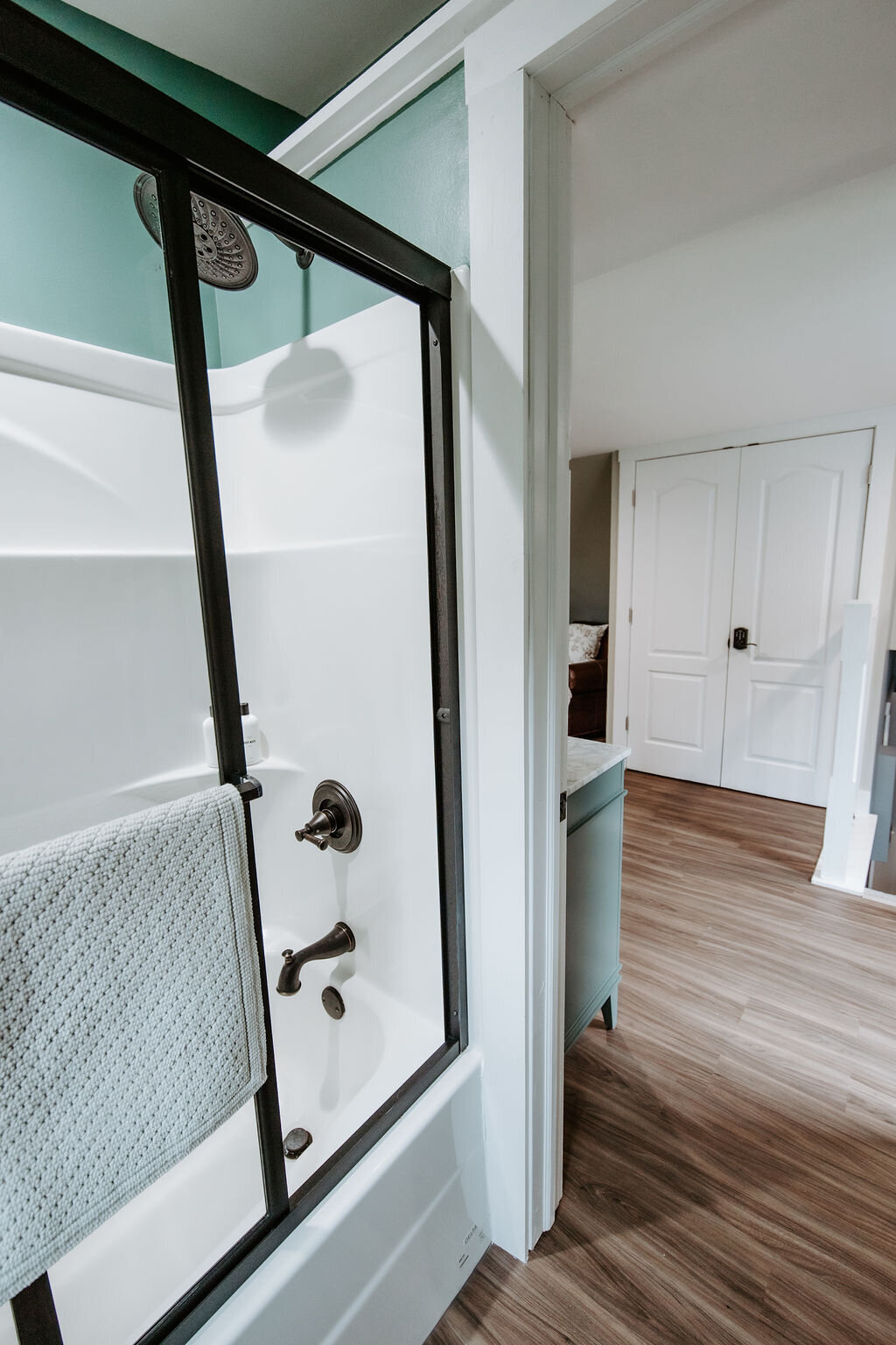 a view of the glass enclosed shower area in the bathroom of the cottage suite at Willowbrook wedding venue