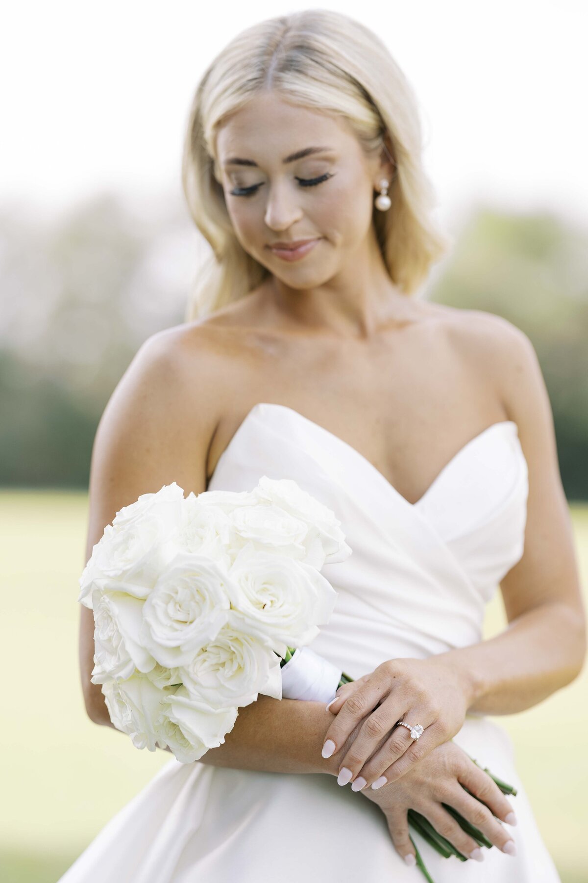 a bride holding a white flower bouquet