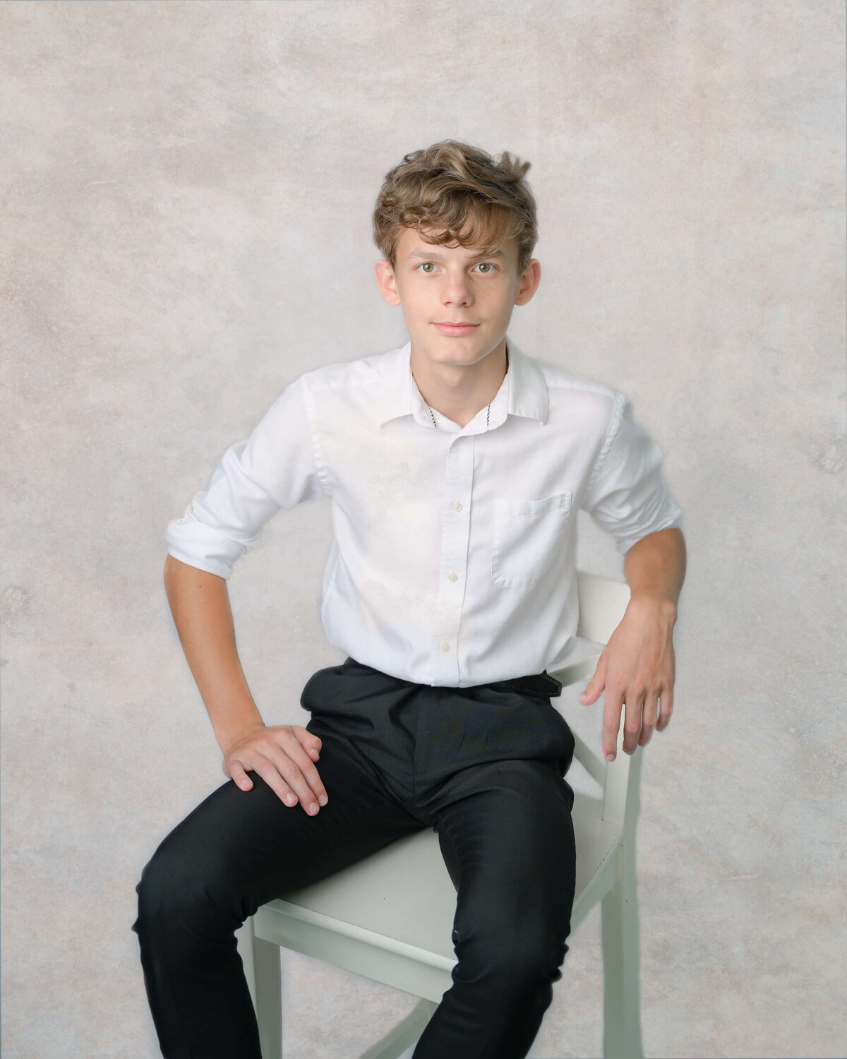 Dylan poses casually in his McKinney, TX home for his family photo session.