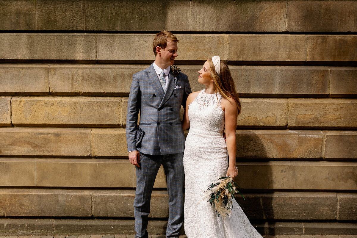 bride and groom having portraits in leeds city centre