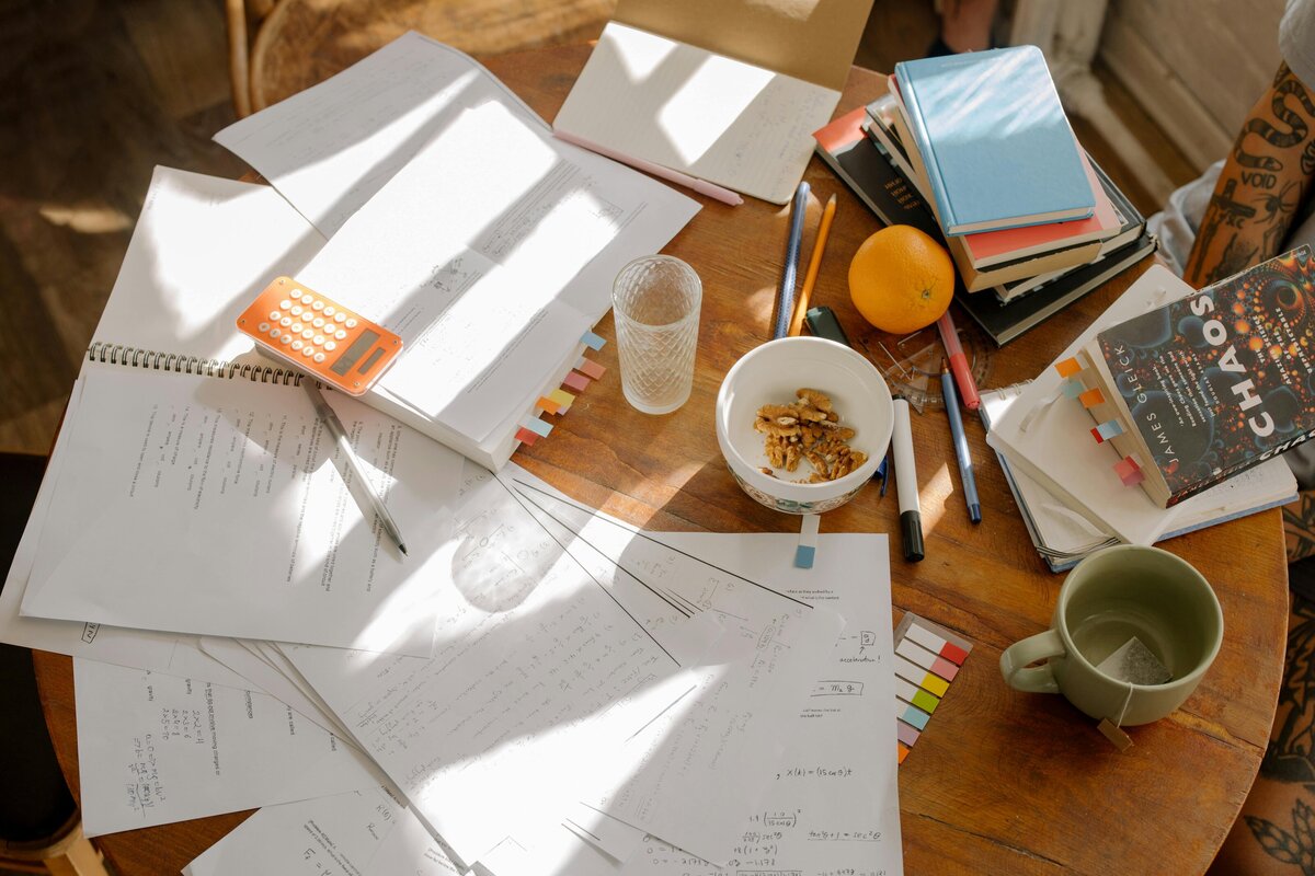 desk with papers and cup of tea