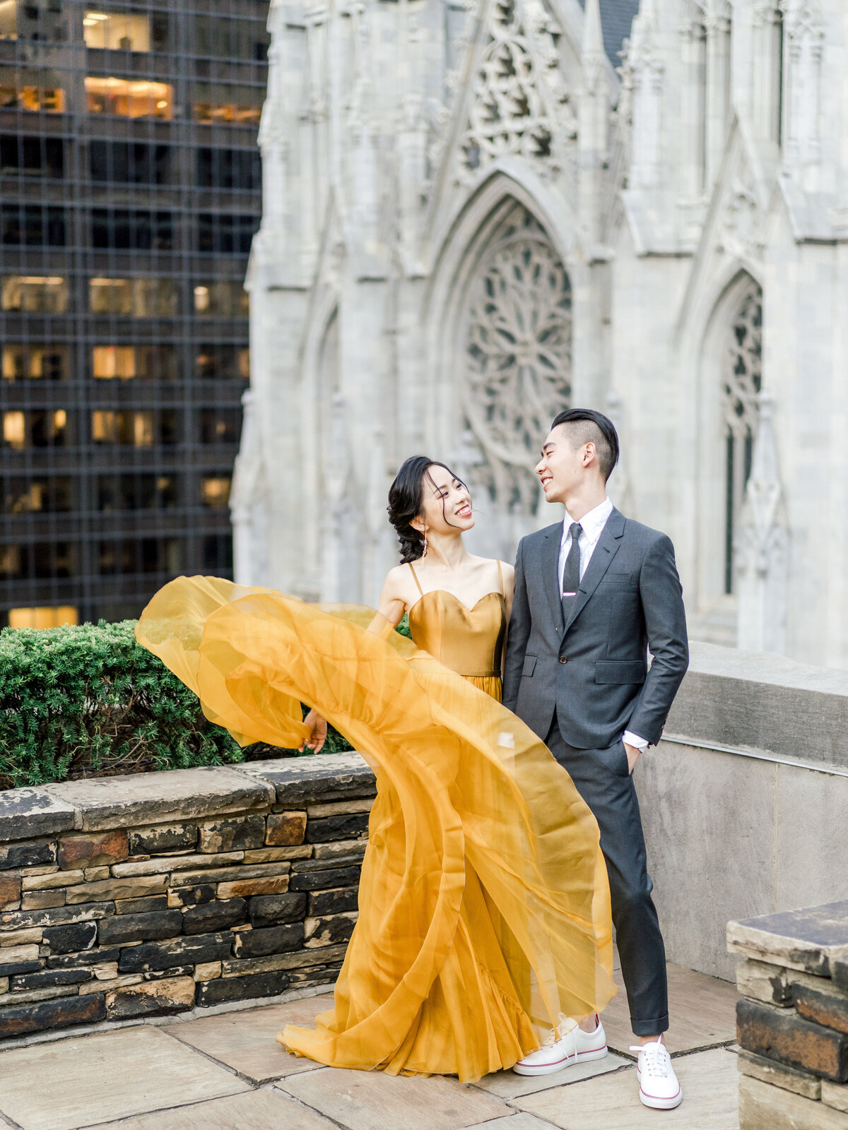 Bride in Leanne Marshall mustard yellow dress on rooftop in NYC
