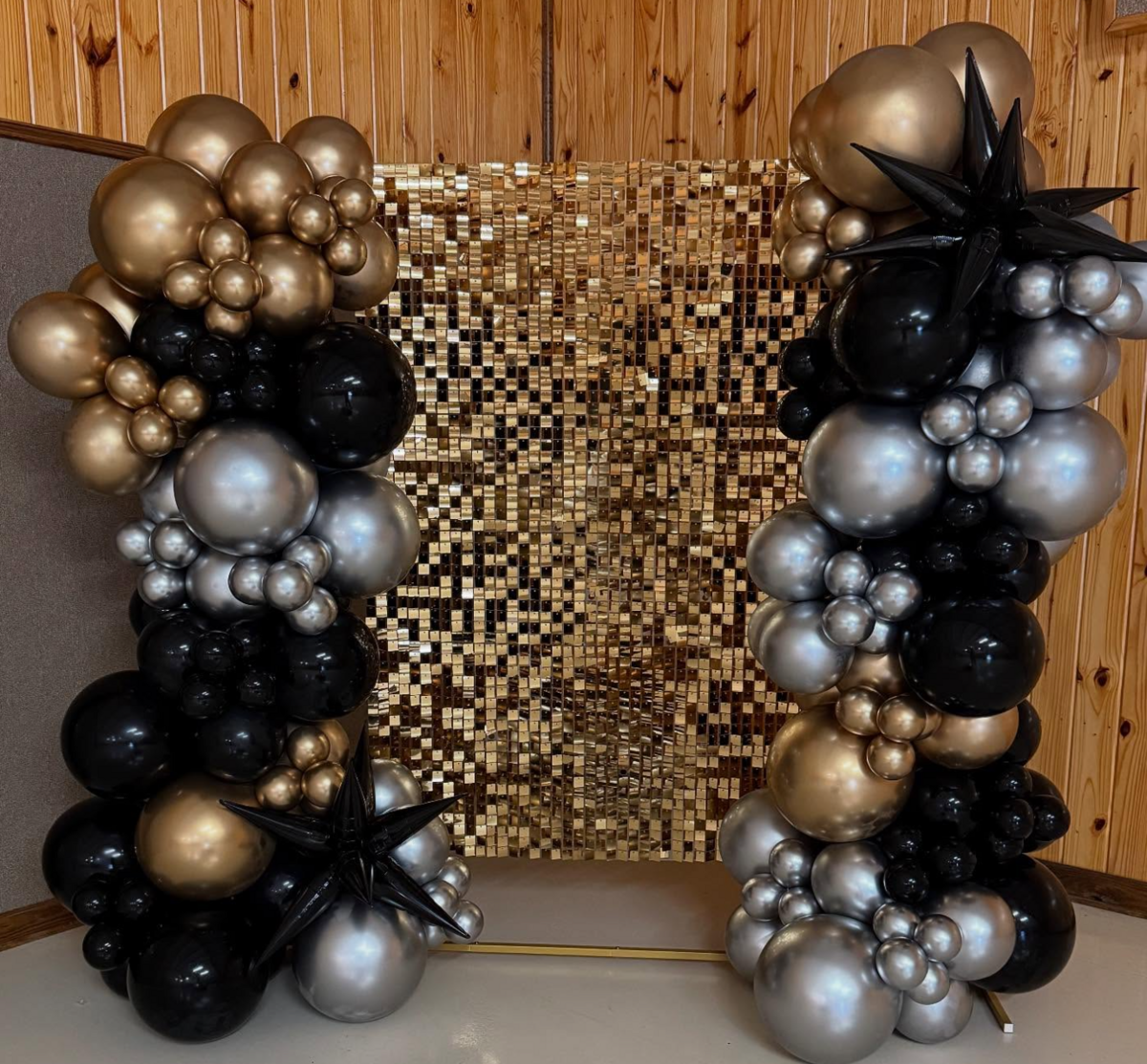 gold, black balloons with shimmer wall