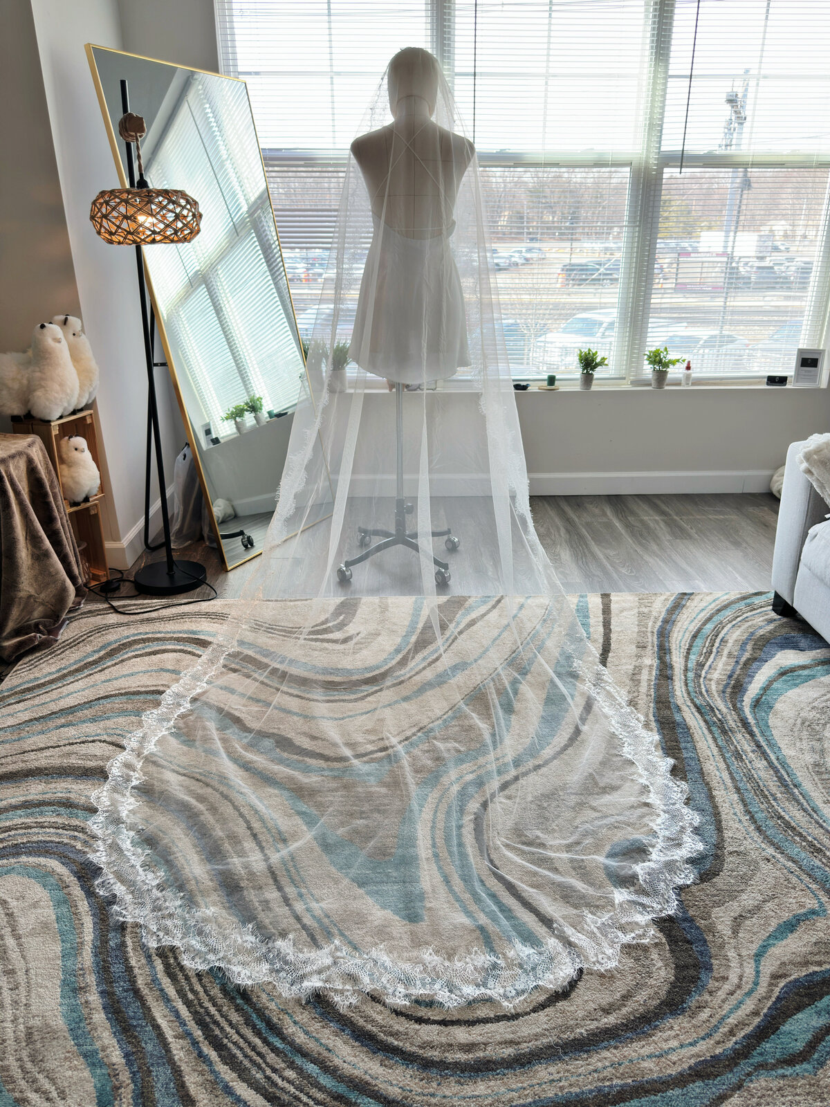 Bride in classic mantilla veil with embroidered floral lace detailing