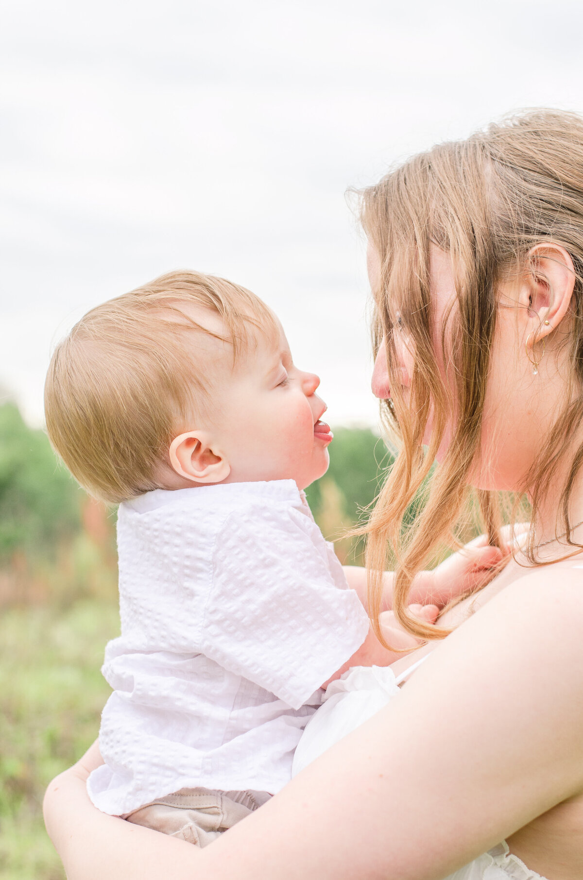 baby gives mom kisses