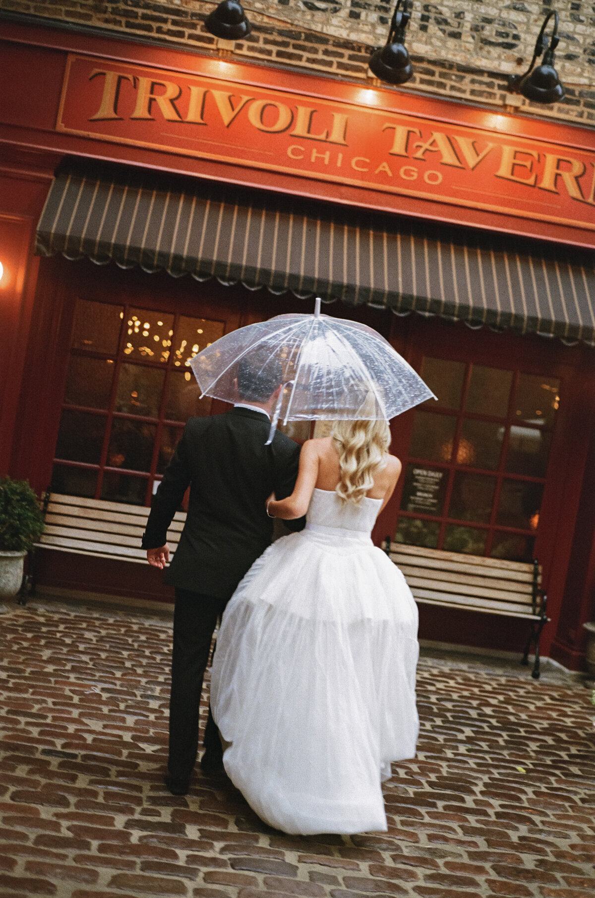 Film photography captures editorial ceremony elegance at Old Post Office Chicago with Lauren Alatriste's fashion forward approach, showcasing architectural grandeur while maintaining sophisticated magazine-worthy imagery and authentic wedding  emotion.