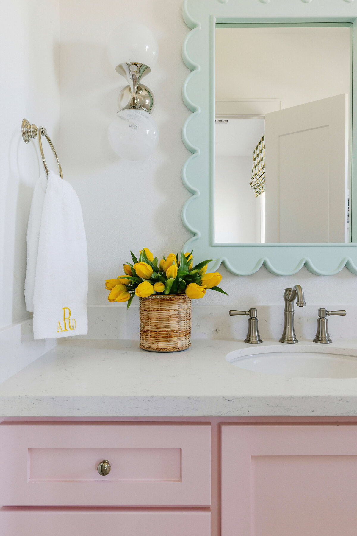 oyster creek studios lighthouse on the lake pink vanity with light teal mirror in bathroom