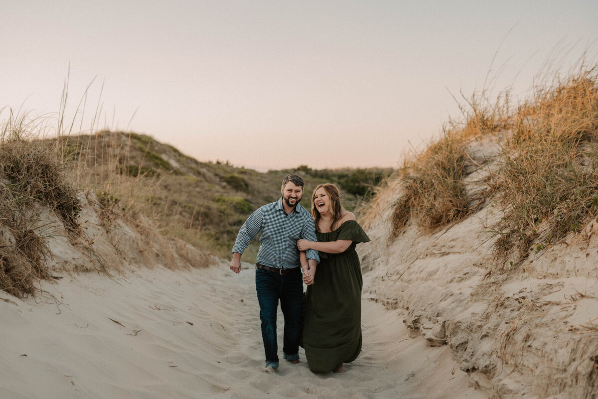 A couple walking and holding hands