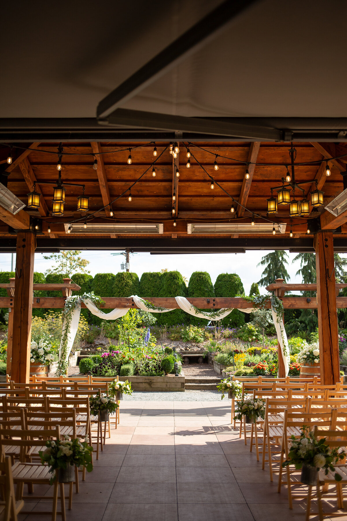 wedding ceremony patio and arch at willows lodge garden
