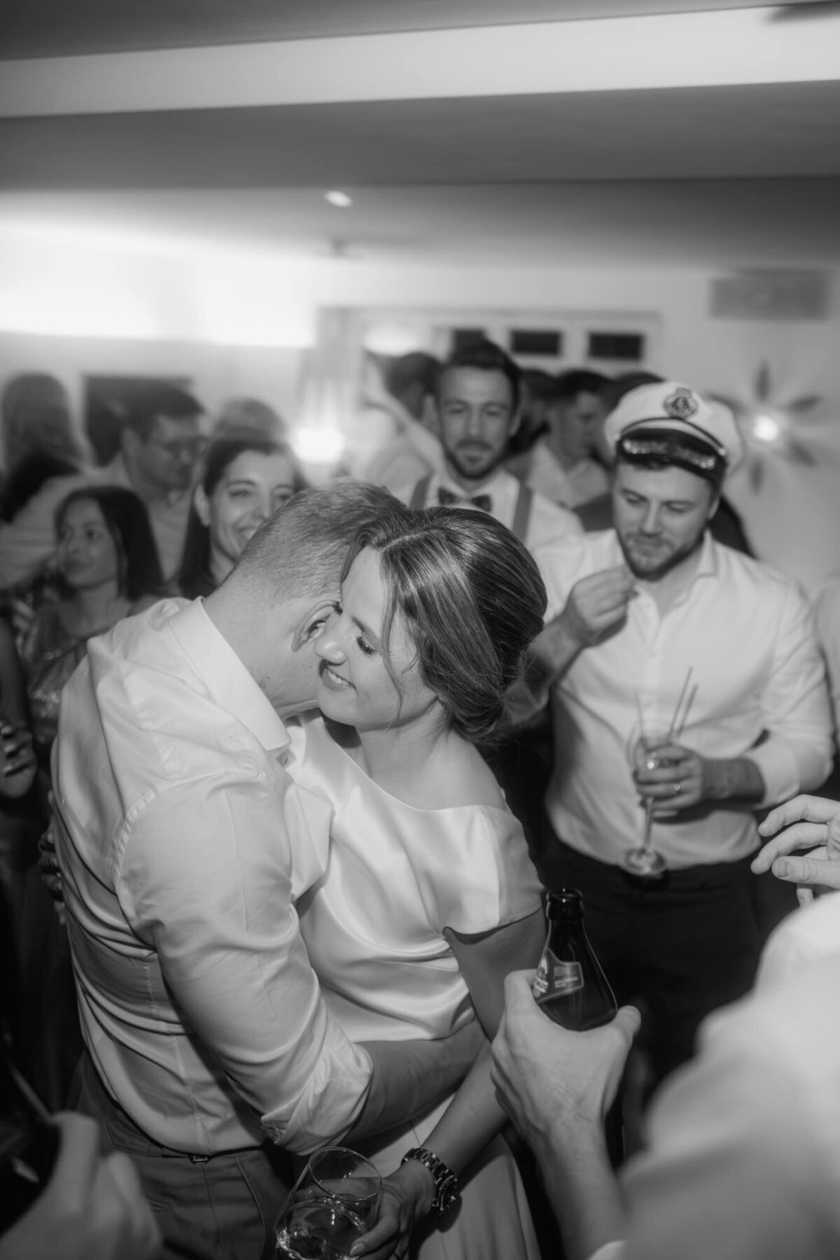 Visibly happy the wedding couple enyojs their wedding party.