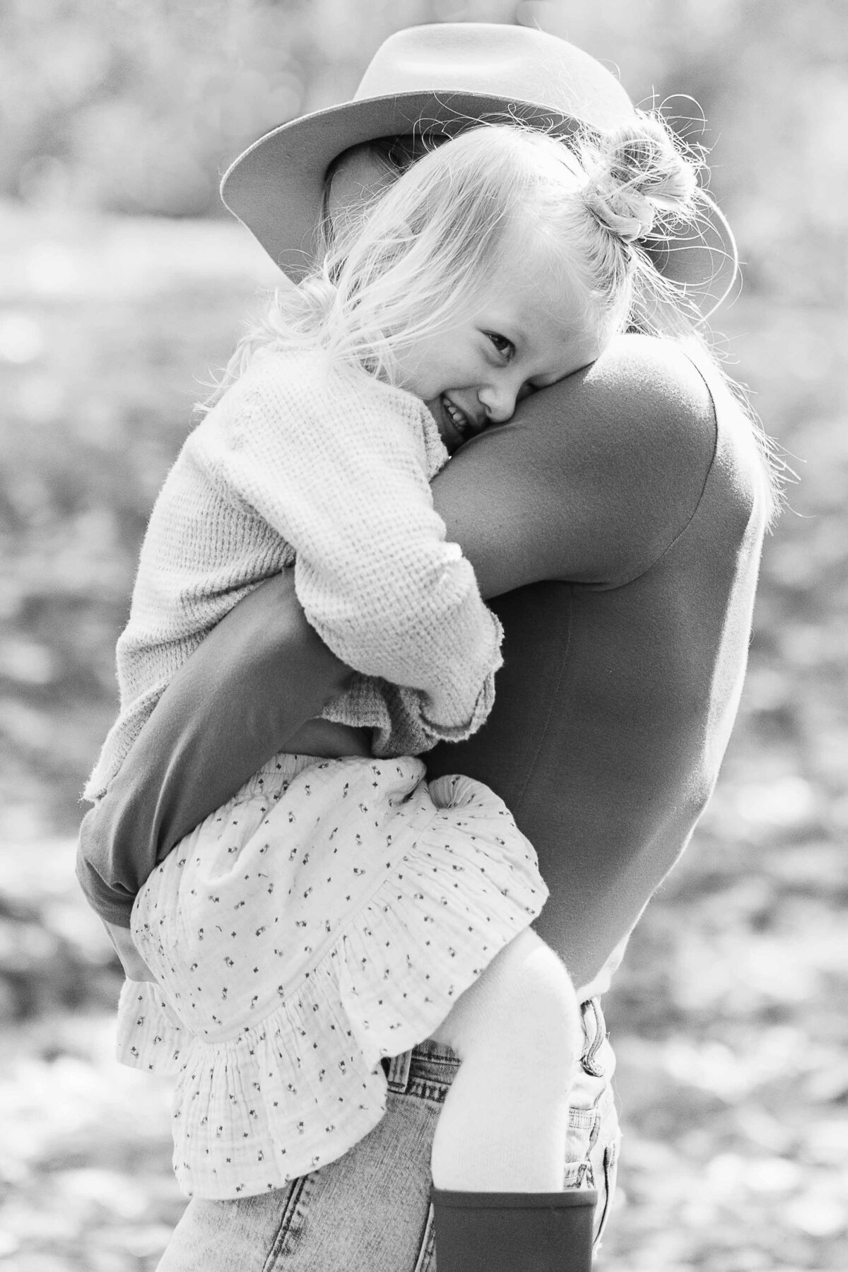 mom hugging toddler daughter