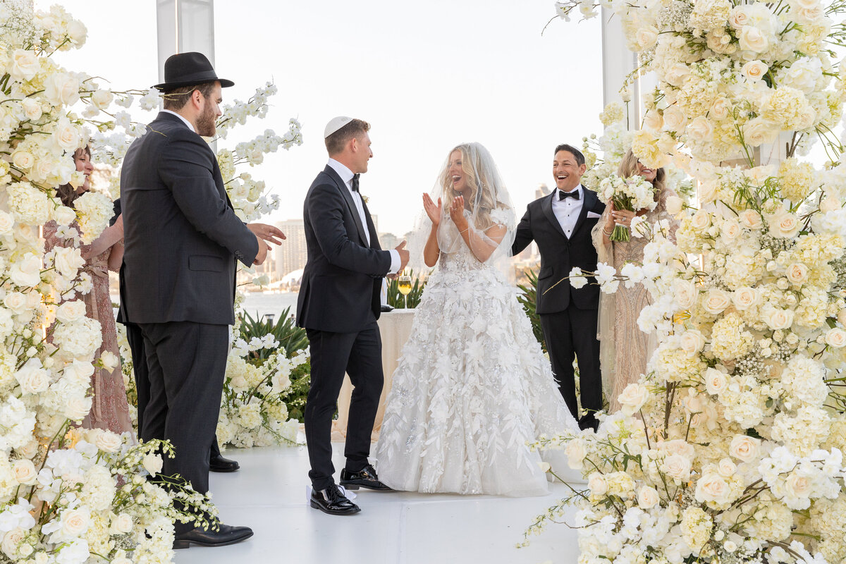 A bride walking towards her groom during their wedding ceremony