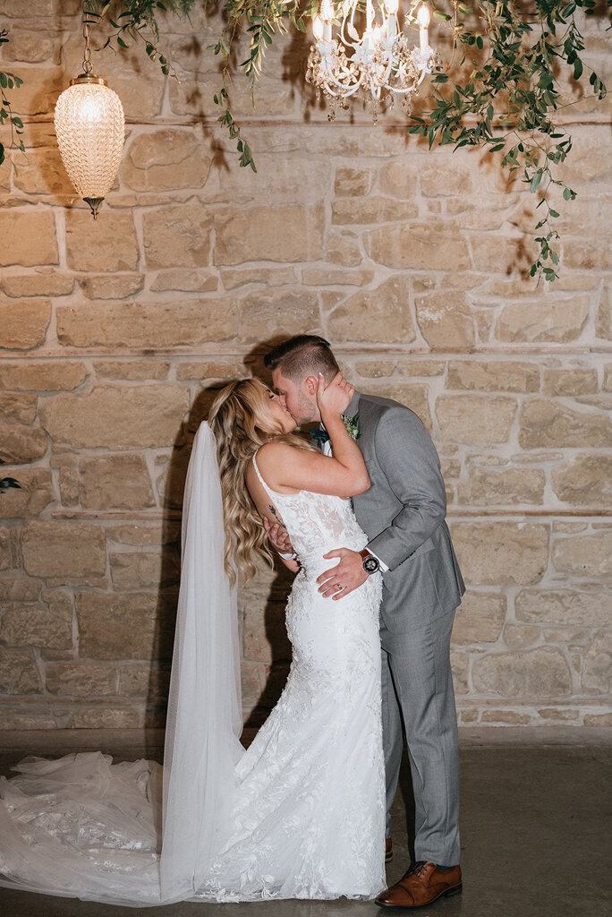 Bride and groom at The Pioneer, a historical industrial wedding venue in Calgary, featured on the Brontë Bride Vendor Guide.