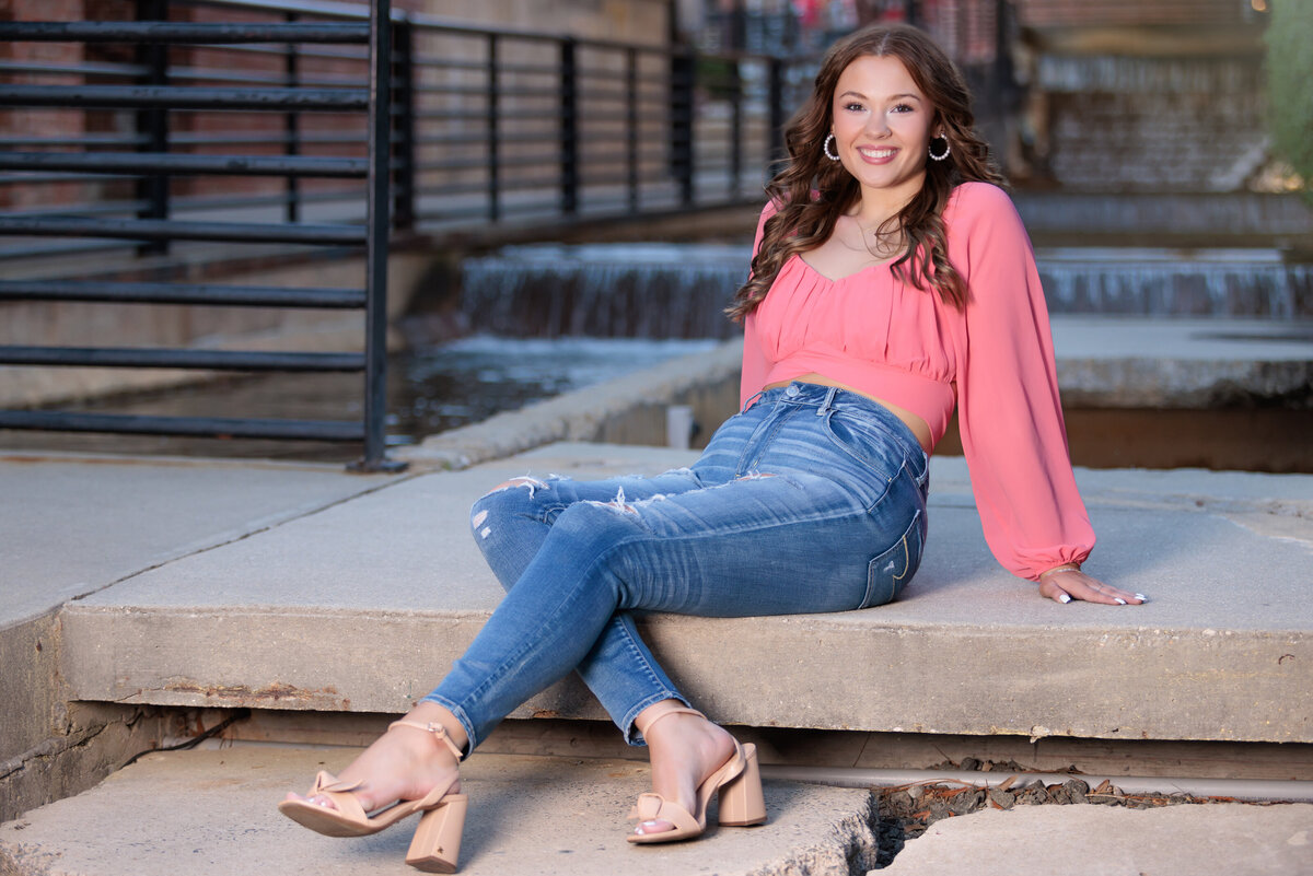 Raleigh Senior Pictures sitting by water with urban vibe