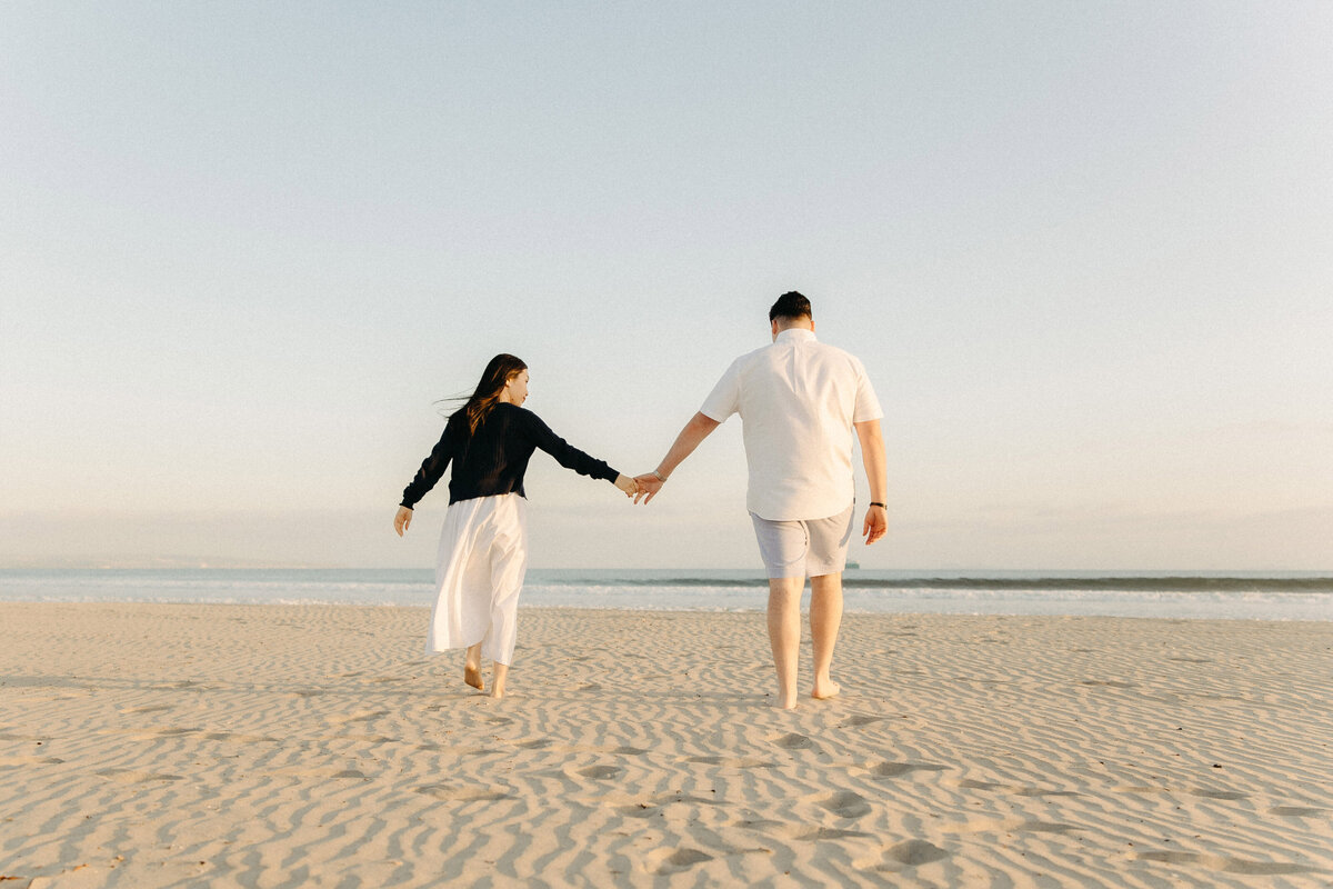 Romantic stroll on sandy Coronado Beach in San Diego