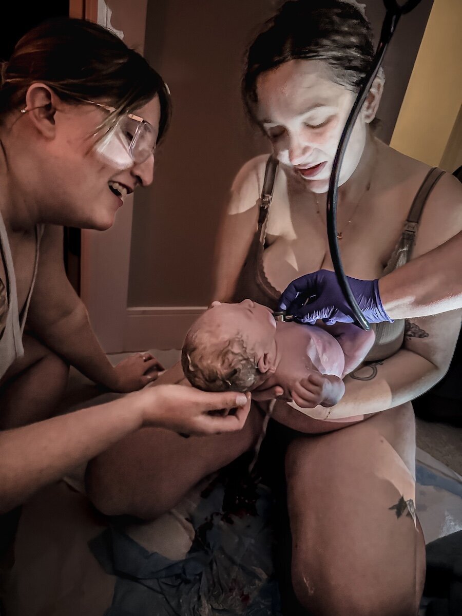 an Edmonton mom holding her baby after giving birth