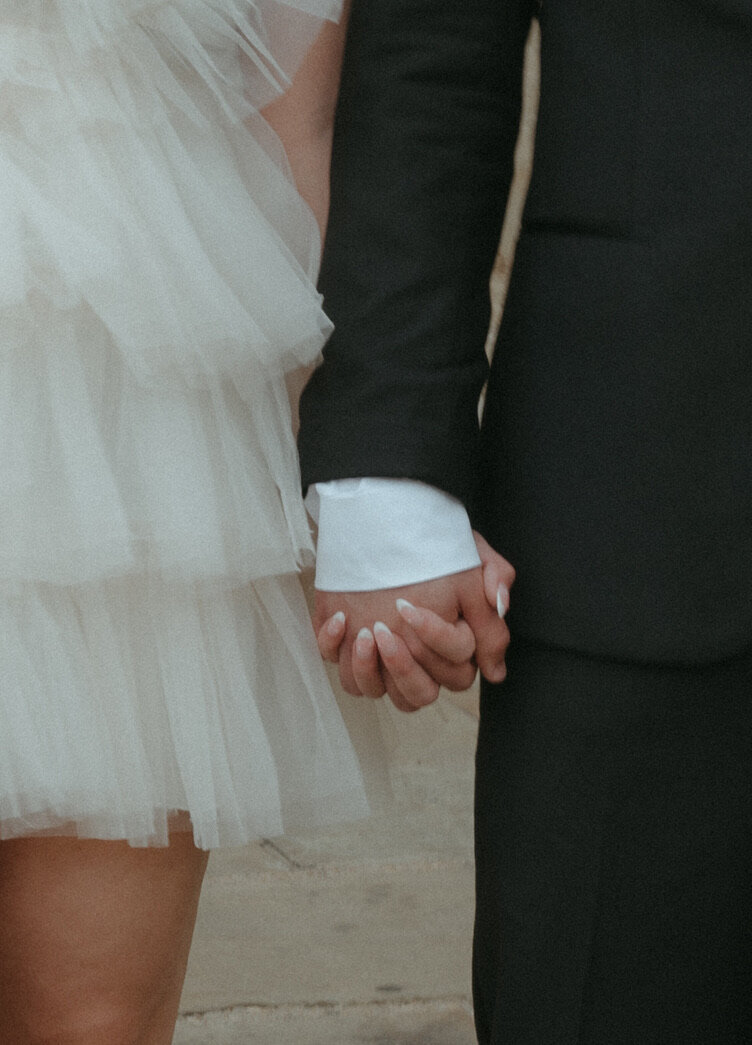 couple holding hands during elopement