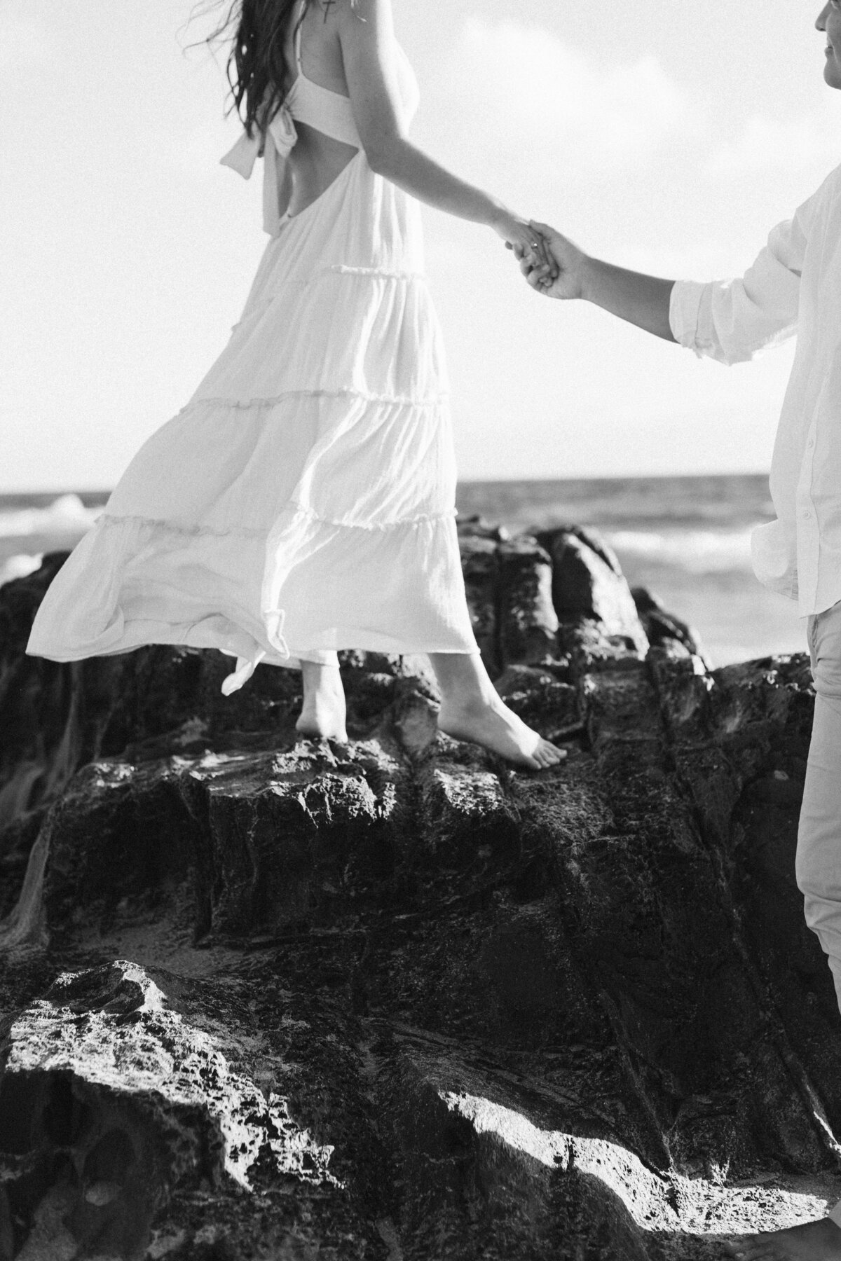 black-and-white-couple-on-rocks-in-hawaii