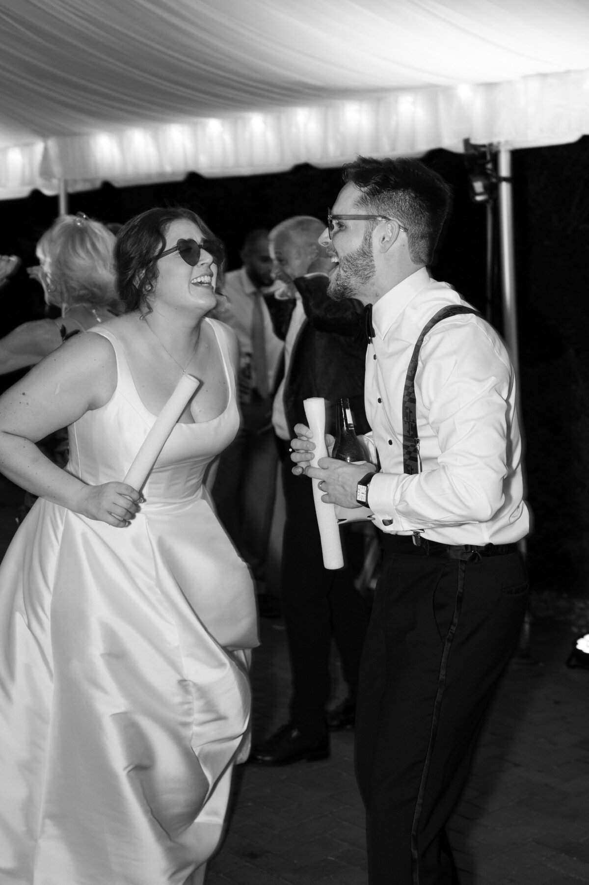 Newlyweds singing and dancing at their wedding reception