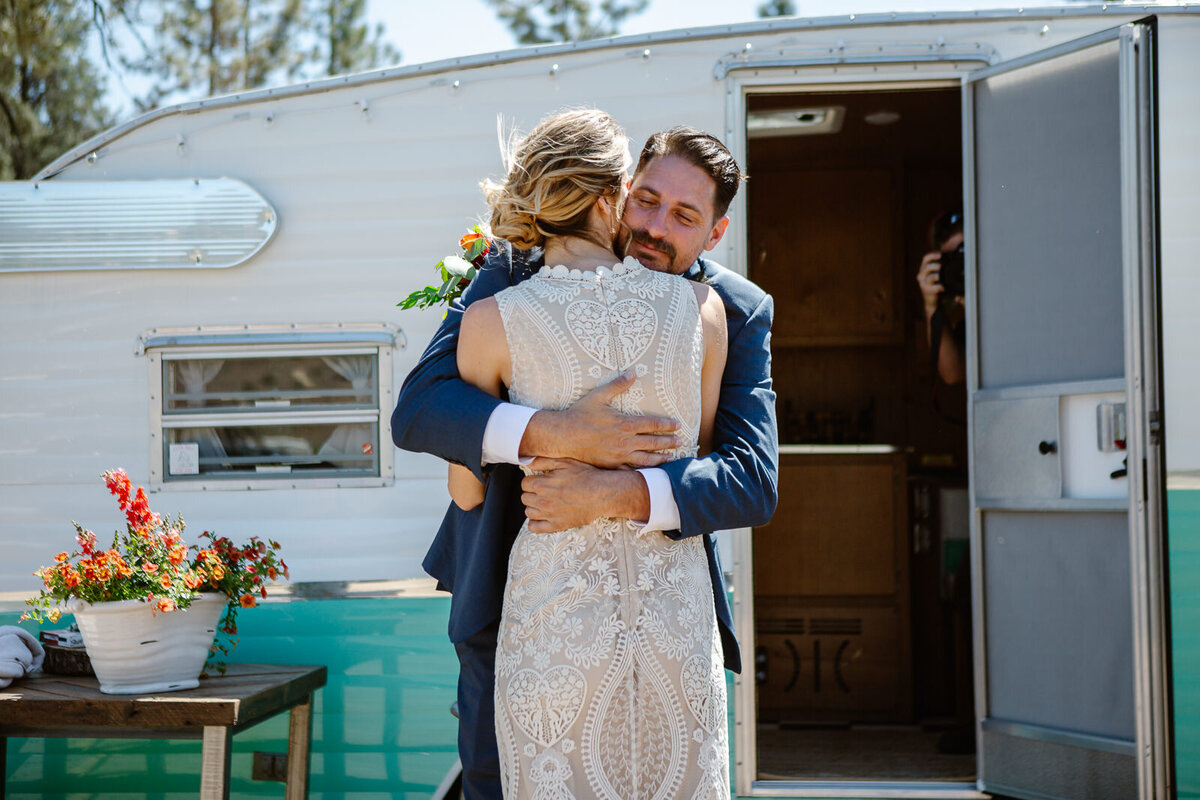 A couple embraces one another on their wedding day during a first look.